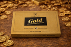 Box of Belgian Gold chocolate surrounded by gold coins on a brown surface